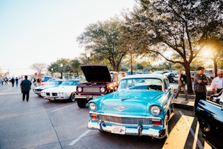 Antique cars along Main Street during First Friday in Historic Downtown Bryan, Texas