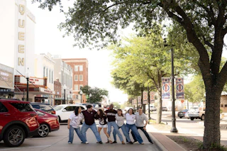 Group of Aggie friends "sawing 'em off" in Historic Downtown Bryan