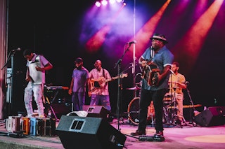 A band performs on stage at a concert in Bryan, Texas.